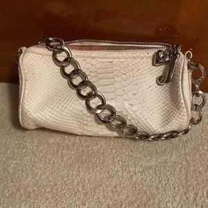 Juicy Couture white snack skin purse with silver chain.